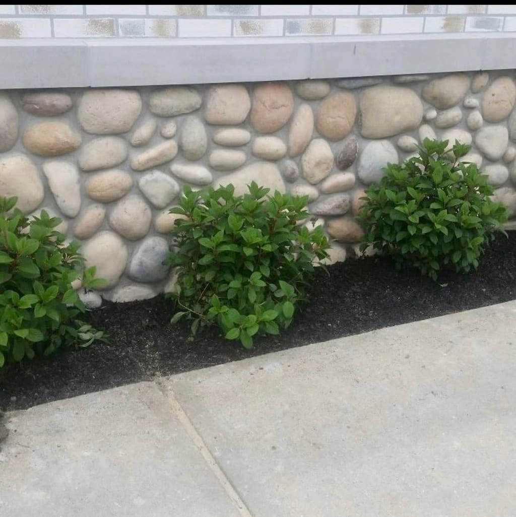 River-rock veneer foundation